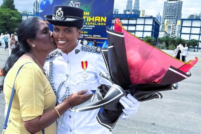 Shree Sharmini, bekas atlet karate kini pegawai polis berpangkat Inspektor.